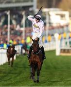 11 March 2025: Jockey Lorcan Williams, aboard Golden Ace, celebrates winning the Unibet Champion Hurdle on day one of the Cheltenham Racing Festival at Prestbury Park in Cheltenham, England. Photo by Harry Murphy/Sportsfile
