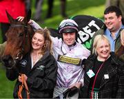 11 March 2025; Jockey Lorcan Williams with groom Emily Meek and winning connections after winning the Unibet Champion Hurdle with Golden Ace on day one of the Cheltenham Racing Festival at Prestbury Park in Cheltenham, England. Photo by Harry Murphy/Sportsfile