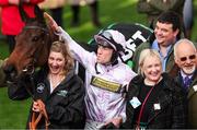 11 March 2025; Jockey Lorcan Williams with groom Emily Meek and winning connections after winning the Unibet Champion Hurdle with Golden Ace on day one of the Cheltenham Racing Festival at Prestbury Park in Cheltenham, England. Photo by Harry Murphy/Sportsfile