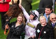 11 March 2025; Jockey Lorcan Williams with groom Emily Meek and winning connections after winning the Unibet Champion Hurdle with Golden Ace on day one of the Cheltenham Racing Festival at Prestbury Park in Cheltenham, England. Photo by Harry Murphy/Sportsfile