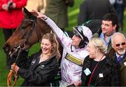 11 March 2025; Jockey Lorcan Williams with groom Emily Meek and winning connections after winning the Unibet Champion Hurdle with Golden Ace on day one of the Cheltenham Racing Festival at Prestbury Park in Cheltenham, England. Photo by Harry Murphy/Sportsfile