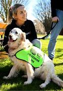 12 March 2025; Ambassador guide dog Belle and Leitrim footballer Clare Owens during the launch of the GPA and Irish Guide Dogs for the Blind official charity partnership between the two organisations for 2025, at the National Botanic Gardens of Ireland in Glasnevin, Dublin. Photo by Seb Daly/Sportsfile