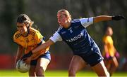 13 March 2025; Orlaith Byrne of DCU Dóchas Éireann is tackled by Caoimhe Doherty of UU Coleraine during the 2025 AIG HEC Cup final match between UU Coleraine and DCU Dóchas Éireann at Queen's Sport in Belfast. Photo by Shauna Clinton/Sportsfile