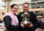 13 March 2025; Jockey Rachael Blackmore and trainer Henry de Bromhead celebrate with the cup after winning the Paddy Power Stayers' Hurdle on Bob Olinger during day three of the Cheltenham Racing Festival at Prestbury Park in Cheltenham, England. Photo by Harry Murphy/Sportsfile
