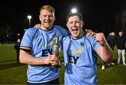 13 March 2025; UCD players Matthew Healy, left, and Chris Hennessy celebrate with the cup after their victory in the annual men’s Rugby Colours match between Dublin University and UCD at UCD Bowl in Dublin. Photo by Sam Barnes/Sportsfile