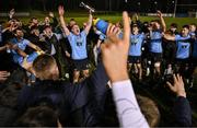 13 March 2025; Chris Hennessy of UCD, centre, leads the celebrations with the cup after their side's victory in the annual men’s Rugby Colours match between Dublin University and UCD at UCD Bowl in Dublin. Photo by Sam Barnes/Sportsfile