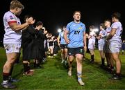 13 March 2025; Chris Hennessy of UCD leads his team off the pitch after their victory in the annual men’s Rugby Colours match between Dublin University and UCD at UCD Bowl in Dublin. Photo by Sam Barnes/Sportsfile
