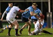 13 March 2025; Tom O'Riordan of UCD in action against Cole Kelly, left, and Dave Walsh of Dublin University during the annual men’s Rugby Colours match between Dublin University and UCD at UCD Bowl in Dublin. Photo by Sam Barnes/Sportsfile