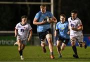 13 March 2025; Conor O'Tighearhaigh of UCD makes a break during the annual men’s Rugby Colours match between Dublin University and UCD at UCD Bowl in Dublin. Photo by Sam Barnes/Sportsfile