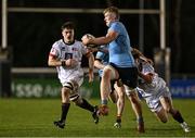13 March 2025; Conor O'Tighearhaigh of UCD is tackled by Oscar Cawley of Dublin University, right, during the annual men’s Rugby Colours match between Dublin University and UCD at UCD Bowl in Dublin. Photo by Sam Barnes/Sportsfile