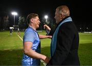 13 March 2025; Chris Hennessy of UCD is congratulated by UCD Rugby President Barry Sheehan after his side's victory in the annual men’s Rugby Colours match between Dublin University and UCD at UCD Bowl in Dublin. Photo by Sam Barnes/Sportsfile
