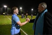 13 March 2025; Chris Hennessy of UCD is congratulated by UCD Rugby President Barry Sheehan after his side's victory in the annual men’s Rugby Colours match between Dublin University and UCD at UCD Bowl in Dublin. Photo by Sam Barnes/Sportsfile