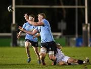 13 March 2025; Conor O'Tighearhaigh of UCD is tackled by Oscar Cawley of Dublin University, right, during the annual men’s Rugby Colours match between Dublin University and UCD at UCD Bowl in Dublin. Photo by Sam Barnes/Sportsfile