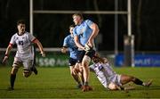 13 March 2025; Conor O'Tighearhaigh of UCD is tackled by Oscar Cawley of Dublin University, right, during the annual men’s Rugby Colours match between Dublin University and UCD at UCD Bowl in Dublin. Photo by Sam Barnes/Sportsfile