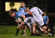 13 March 2025; Tom O'Riordan of UCD in action against, from left, Dylan Ryan, Zach Baird and Arthur O'Rahilly of Dublin University during the annual men’s Rugby Colours match between Dublin University and UCD at UCD Bowl in Dublin. Photo by Sam Barnes/Sportsfile