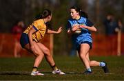 14 March 2025; Ciara Crowley of UCD in action against Katie Mai O'Reilly of DCU Dóchas Éireann 2 during the 2025 Ladies HEC Giles Cup semi-final match between UCD and DCU Dóchas Éireann 2 at Queen's Sport in Belfast. Photo by Ben McShane/Sportsfile