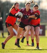 14 March 2025; Marta Barek of UG in action against UCC players Evie Twomey, left, and Aoife Healy during the 2025 Ladies AIG HEC O'Connor Cup semi-final match between University College Cork and University of Galway at Queen's Sport, Queens University, Belfast. Photo by Shauna Clinton/Sportsfile