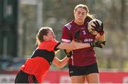 14 March 2025; Maryann Jordan of UG is tackled by Aoife Healy of UCC during the 2025 Ladies AIG HEC O'Connor Cup semi-final match between University College Cork and University of Galway at Queen's Sport, Queens University, Belfast. Photo by Shauna Clinton/Sportsfile