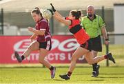 14 March 2025; Muireann Devanney of UG has a kick blocked by Roisin Ennis of UCC during the 2025 Ladies AIG HEC O'Connor Cup semi-final match between University College Cork and University of Galway at Queen's Sport, Queens University, Belfast. Photo by Shauna Clinton/Sportsfile