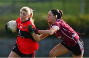 14 March 2025; Emma Morrissey of UCC in action against Saoirse Wynne of UG during the 2025 Ladies AIG HEC O'Connor Cup semi-final match between University College Cork and University of Galway at Queen's Sport, Queens University, Belfast. Photo by Shauna Clinton/Sportsfile
