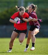 14 March 2025; Brid McMaugh of UCC is tackled by Eabha O'Riordan of UG during the 2025 Ladies AIG HEC O'Connor Cup semi-final match between University College Cork and University of Galway at Queen's Sport, Queens University, Belfast. Photo by Shauna Clinton/Sportsfile