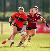 14 March 2025; Emma Morrissey of UCC in action against Saoirse Wynne of UG during the 2025 Ladies AIG HEC O'Connor Cup semi-final match between University College Cork and University of Galway at Queen's Sport, Queens University, Belfast. Photo by Shauna Clinton/Sportsfile