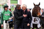 14 March 2025; Part-owner Anthony Bromley, right, celebrates with former jockey Daryl Jacob, after winning The Albert Bartlett  Novices’ Hurdle Race with Jasmin De Vaux on day four of the Cheltenham Racing Festival at Prestbury Park in Cheltenham, England. Photo by Harry Murphy/Sportsfile