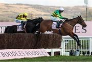 14 March 2025; Inothewayurthinkin, with Mark Walsh up, jump the last ahead of eventual second place Galopin Des Champs, with Paul Townend up, on their way to winning Boodles Cheltenham Gold Cup Steeple Chase on day four of the Cheltenham Racing Festival at Prestbury Park in Cheltenham, England. Photo by Harry Murphy/Sportsfile