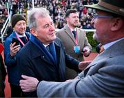 14 March 2025; JP McManus, owner of the winning horse Inothewayurthinkin, is congratulated by Greg Turley, owner of second placed Galopin Des Champs, after Boodles Cheltenham Gold Cup Steeple Chase on day four of the Cheltenham Racing Festival at Prestbury Park in Cheltenham, England. Photo by David Fitzgerald/Sportsfile