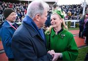 14 March 2025; JP McManus, owner of the winning horse Inothewayurthinkin, is congratulated by Audrey Turley, owner of second placed Galopin Des Champs, after Boodles Cheltenham Gold Cup Steeple Chase on day four of the Cheltenham Racing Festival at Prestbury Park in Cheltenham, England. Photo by David Fitzgerald/Sportsfile
