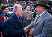 14 March 2025; JP McManus, owner of the winning horse Inothewayurthinkin, is congratulated by Greg Turley, owner of second placed Galopin Des Champs, after Boodles Cheltenham Gold Cup Steeple Chase on day four of the Cheltenham Racing Festival at Prestbury Park in Cheltenham, England. Photo by David Fitzgerald/Sportsfile