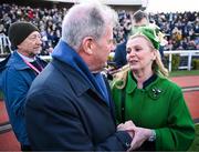 14 March 2025; JP McManus, owner of the winning horse Inothewayurthinkin, is congratulated by Audrey Turley, owner of second placed Galopin Des Champs, after the Boodles Cheltenham Gold Cup Steeple Chase on day four of the Cheltenham Racing Festival at Prestbury Park in Cheltenham, England. Photo by David Fitzgerald/Sportsfile