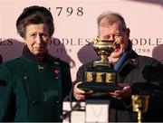 14 March 2025; Princess Anne, Princess Royal, with winning owner JP McManus and the Boodles Cheltenham Gold Cup after Inothewayurthinkin won the Boodles Cheltenham Gold Cup Steeple Chase on day four of the Cheltenham Racing Festival at Prestbury Park in Cheltenham, England. Photo by Harry Murphy/Sportsfile