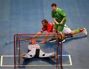 14 March 2025; Goalkeeper Pascal Durrer and captain Stefan Niederberger of Special Olympics Switzerland, twart this effort on goal by Frank O' Dwyer of Team Ireland, a member of Tipperary Special Olympics Club, Ballylandis, Limerick,  during the Bronze place play off, in Floorball, between Special Olympics Ireland and Special Olympics Switzerland during day six of the Turin 2025 Special Olympics World Winter Games in the Inalpi Arena, Turin, Italy. Photo by Ray McManus/Sportsfile
