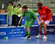 14 March 2025; Frank O' Dwyer of Team Ireland, a member of Tipperary Special Olympics Club, Ballylandis, Limerick, in action against Stefan Niederberger of Special Olympics Switzerland, during the Bronze place play off, in Floorball, between Special Olympics Ireland and Special Olympics Switzerland during day six of the Turin 2025 Special Olympics World Winter Games in the Inalpi Arena, Turin, Italy. Photo by Ray McManus/Sportsfile