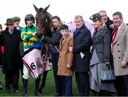 14 March 2025; Winning connections of Inothewayurthinkin, including Frank Berry, manager for JP McManus, jockey Mark Walsh, groom Caoimhe O'Brien, Jake Cromwell, son of trainer Gavin Cromwell; owner JP McManus, Sue-Anne and Kieran McManus after winning the Boodles Cheltenham Gold Cup Steeple Chase on day four of the Cheltenham Racing Festival at Prestbury Park in Cheltenham, England. Photo by Harry Murphy/Sportsfile
