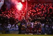 14 March 2025; Drogheda United players and supporters celebrate their first goal, scored by Conor Keeley, hidden, during the SSE Airtricity Men's Premier Division match between Drogheda United and Shamrock Rovers at Sullivan & Lambe Park in Drogheda, Louth. Photo by Ben McShane/Sportsfile