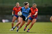 15 March 2025; Brid Cotter of UCD in action against Lydia McDonagh of MIC Limerick during the 2025 Ladies AIG Giles Cup final match between MIC Limerick and UCD at Queen's Sport, Queens University, Belfast. Photo by Ben McShane/Sportsfile