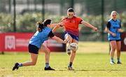 15 March 2025; Ella Thompson of MIC Limerick kicks a point despite the tackle of Ciara Crowley of UCD during the 2025 Ladies AIG Giles Cup final match between MIC Limerick and UCD at Queen's Sport, Queens University, Belfast. Photo by Ben McShane/Sportsfile