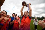 15 March 2025; MIC Limerick captain Aoife Dillane celebrates with the Giles Cup and her teammates after the 2025 Ladies AIG Giles Cup final match between MIC Limerick and UCD at Queen's Sport, Queens University, Belfast. Photo by Ben McShane/Sportsfile