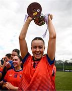 15 March 2025; MIC Limerick captain Aoife Dillane celebrates with the Giles Cup and her teammates after the 2025 Ladies AIG Giles Cup final match between MIC Limerick and UCD at Queen's Sport, Queens University, Belfast. Photo by Ben McShane/Sportsfile