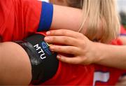 15 March 2025; MTU Cork players wear a black armband in memory of MTU Cork student Darragh McCarthy before the 2025 Ladies AIG Lynch final match between MTU Cork and UCD at Queen's Sport, Queens University, Belfast. Photo by Ben McShane/Sportsfile