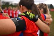 15 March 2025; MTU Cork players wear a black armband in memory of MTU Cork student Darragh McCarthy before the 2025 Ladies AIG Lynch final match between MTU Cork and UCD at Queen's Sport, Queens University, Belfast. Photo by Ben McShane/Sportsfile