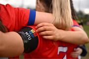 15 March 2025; MTU Cork players wear a black armband in memory of MTU Cork student Darragh McCarthy before the 2025 Ladies AIG Lynch final match between MTU Cork and UCD at Queen's Sport, Queens University, Belfast. Photo by Ben McShane/Sportsfile