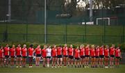 15 March 2025; MTU Cork players observe a moment of silence in memory of MTU Cork student Darragh McCarthy before the 2025 Ladies AIG Lynch final match between MTU Cork and UCD at Queen's Sport, Queens University, Belfast. Photo by Ben McShane/Sportsfile