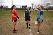 15 March 2025; Referee Sinead McHugh performs the coin-toss in the company of team captains Rachael Evans of MTU Cork, left, and Saoirse Murphy of UCD 2 before the 2025 Ladies AIG Lynch final match between MTU Cork and UCD at Queen's Sport, Queens University, Belfast. Photo by Ben McShane/Sportsfile