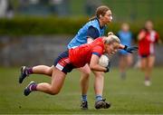 15 March 2025; Aoife Cummins of MTU Cork is tackled by Hannah Crowley of UCD 2 during the 2025 Ladies AIG Lynch final match between MTU Cork and UCD at Queen's Sport, Queens University, Belfast. Photo by Ben McShane/Sportsfile