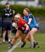 15 March 2025; Aoife Cummins of MTU Cork is tackled by Hannah Crowley of UCD 2 during the 2025 Ladies AIG Lynch final match between MTU Cork and UCD at Queen's Sport, Queens University, Belfast. Photo by Ben McShane/Sportsfile