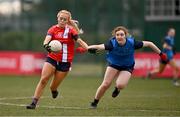 15 March 2025; Maeve Daly of MTU Cork in action against Roisin McKenna of UCD 2 during the 2025 Ladies AIG Lynch final match between MTU Cork and UCD at Queen's Sport, Queens University, Belfast. Photo by Ben McShane/Sportsfile