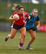 15 March 2025; Ava Looney of MTU Cork in action against Saoirse Murphy of UCD 2 during the 2025 Ladies AIG Lynch final match between MTU Cork and UCD at Queen's Sport, Queens University, Belfast. Photo by Ben McShane/Sportsfile